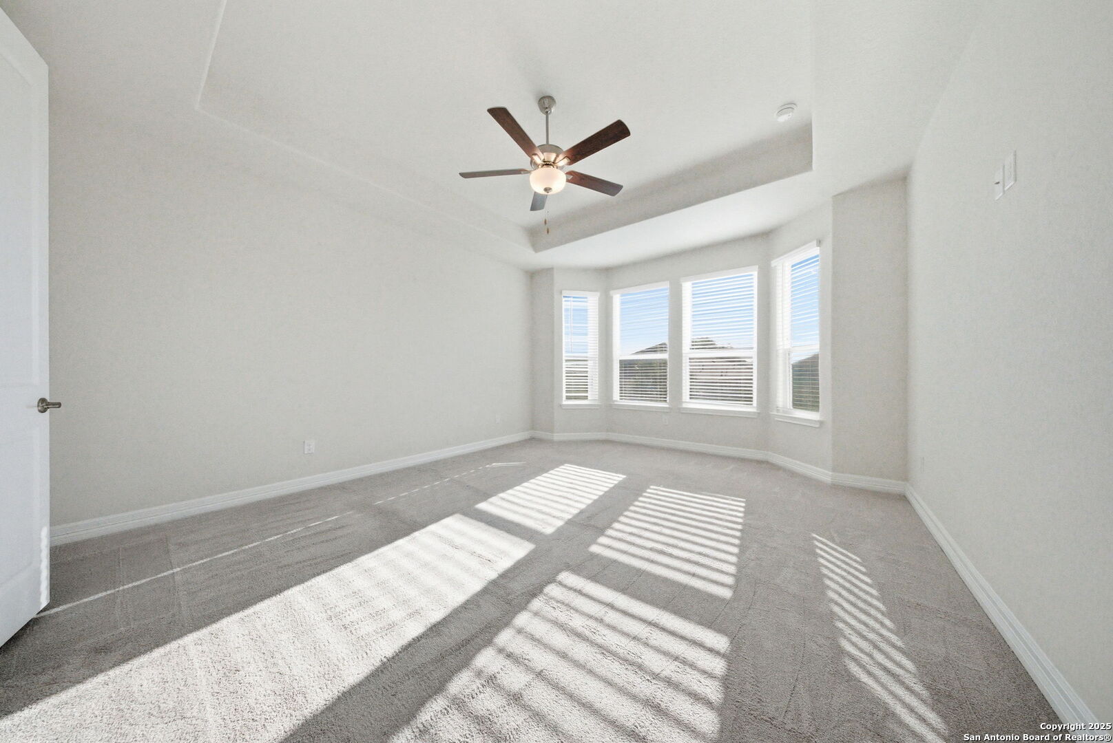662 Hidden View Street New Braunfels, TX 78130 - Photo 21 of 48 a view of a bedroom with wooden floor and windows
