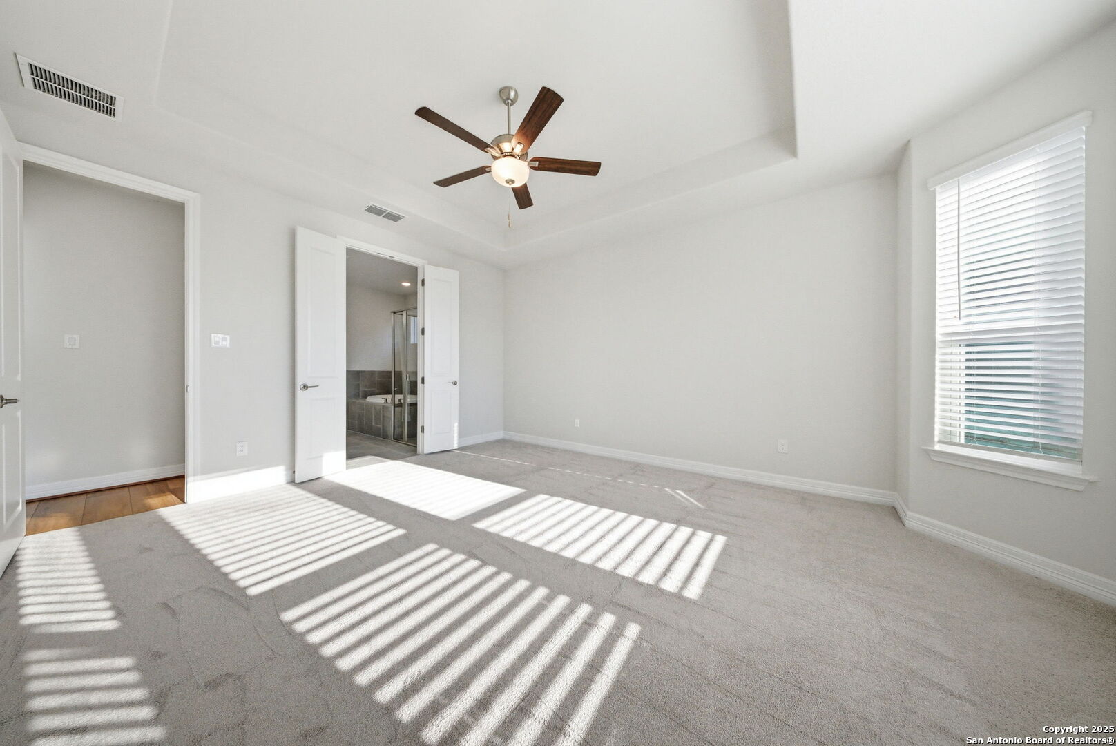 662 Hidden View Street New Braunfels, TX 78130 - Photo 22 of 48 a bedroom with a bed and a window