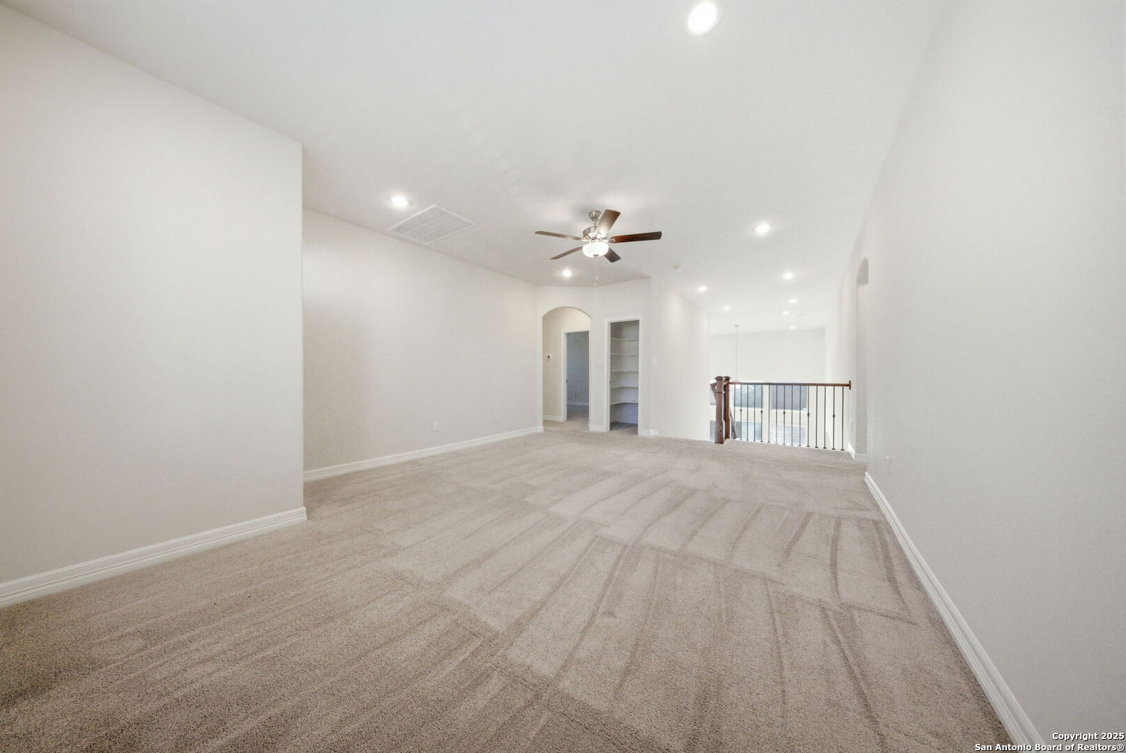 662 Hidden View Street New Braunfels, TX 78130 - Photo 31 of 48 a view of a livingroom with a sink and a chandelier fan