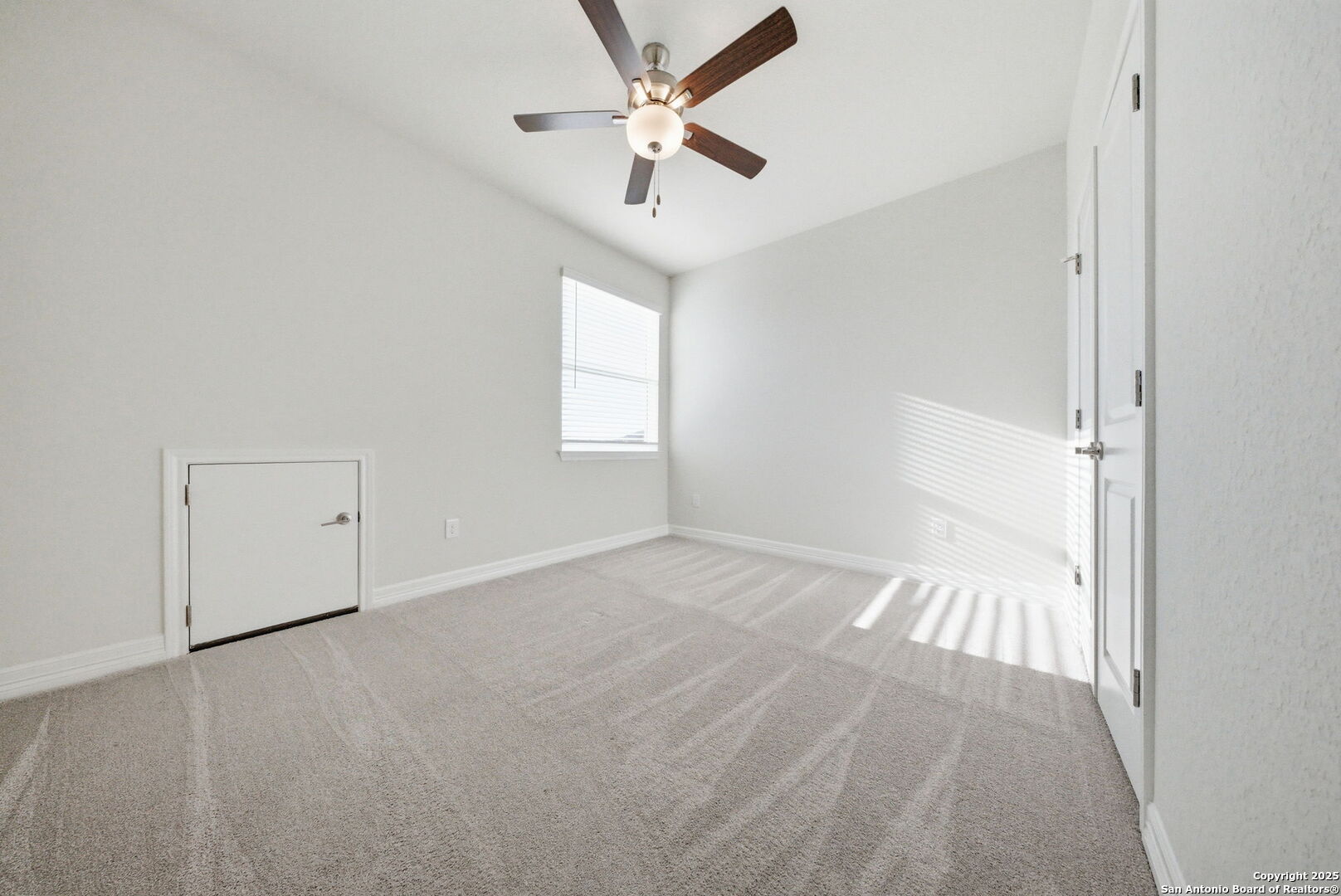 662 Hidden View Street New Braunfels, TX 78130 - Photo 33 of 48 an empty room with fan and windows