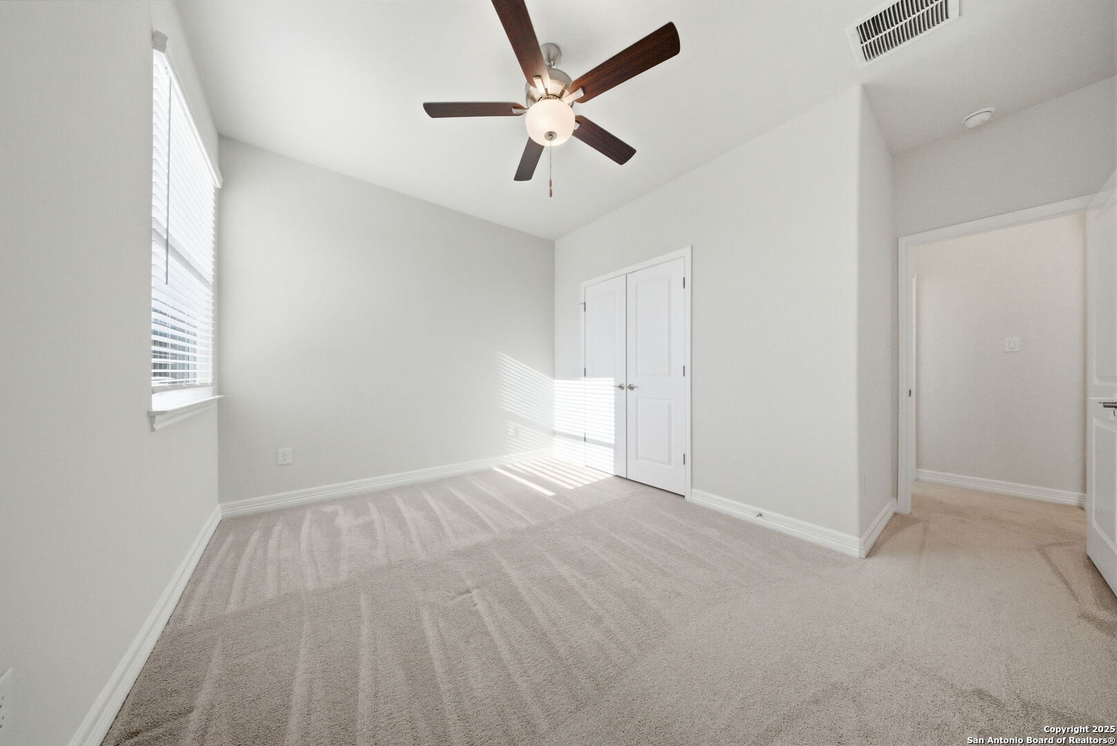 662 Hidden View Street New Braunfels, TX 78130 - Photo 34 of 48 wooden floor in an empty room with a window