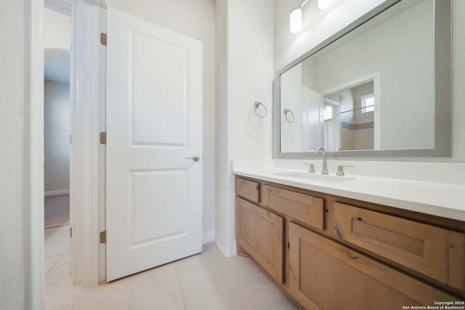 662 Hidden View Street New Braunfels, TX 78130 - Photo 38 of 48 a bathroom with a double vanity sink and mirror