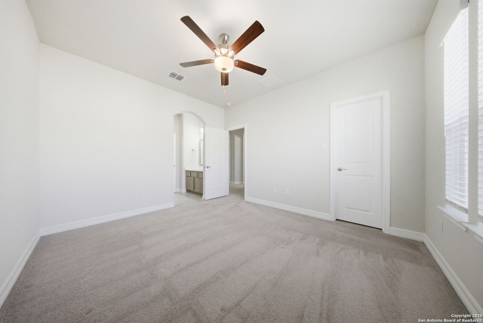 662 Hidden View Street New Braunfels, TX 78130 - Photo 40 of 48 an empty room with ceiling fan and windows
