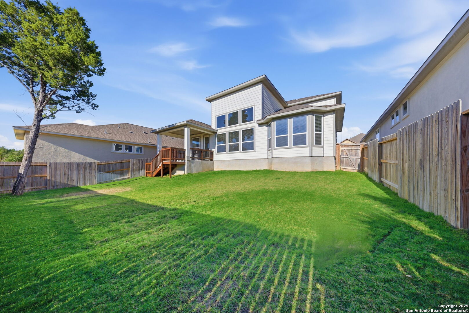 662 Hidden View Street New Braunfels, TX 78130 - Photo 42 of 48 a front view of a house with a garden and trees