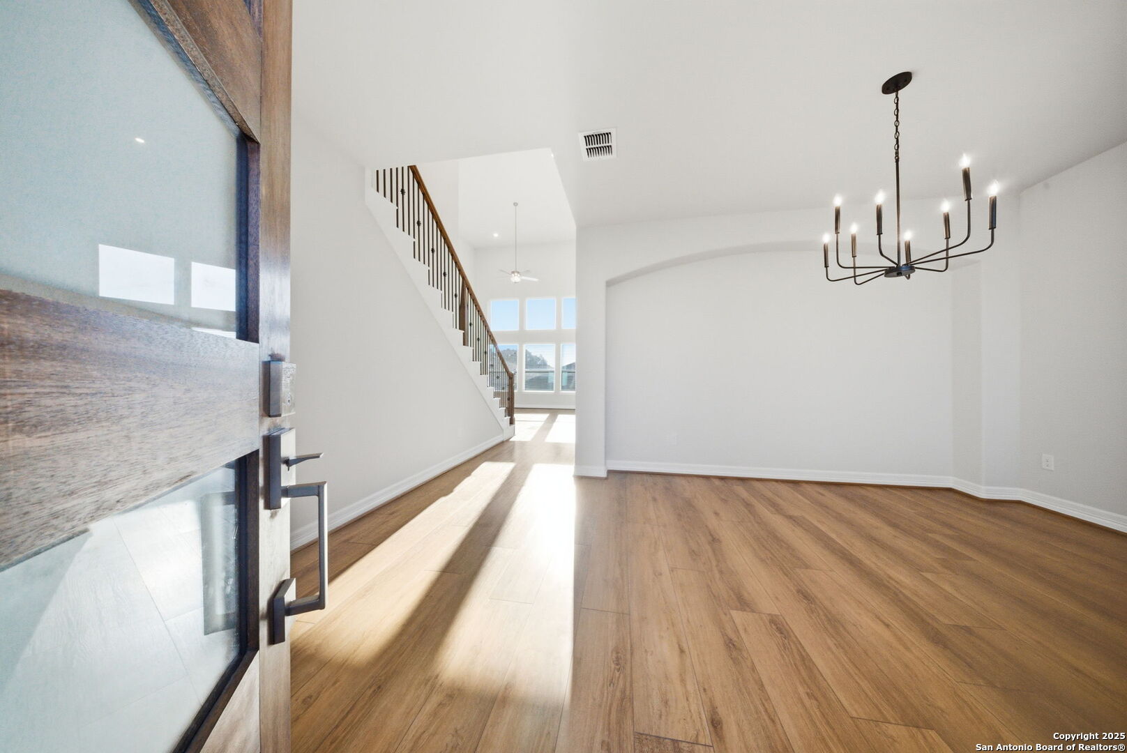 662 Hidden View Street New Braunfels, TX 78130 - Photo 5 of 48 a view of empty room with wooden floor