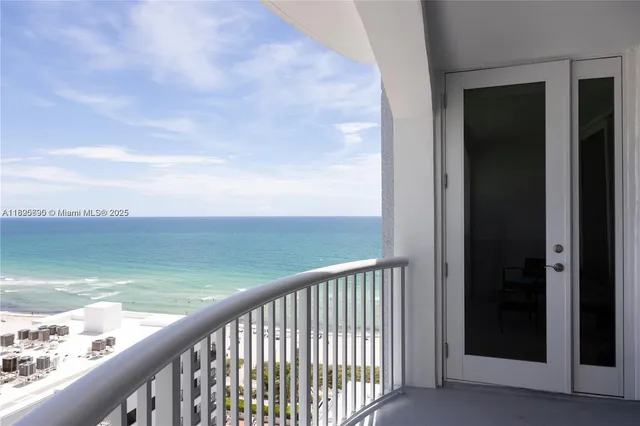 a balcony with an ocean view