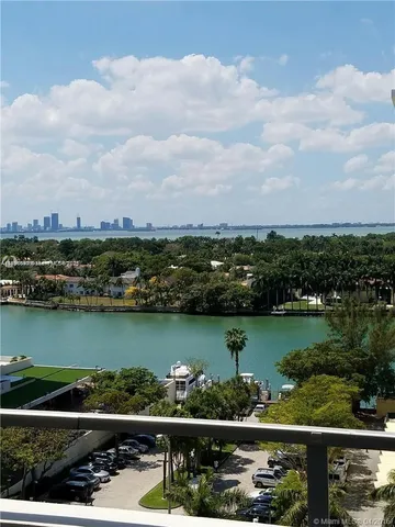 an aerial view of a city and lake view