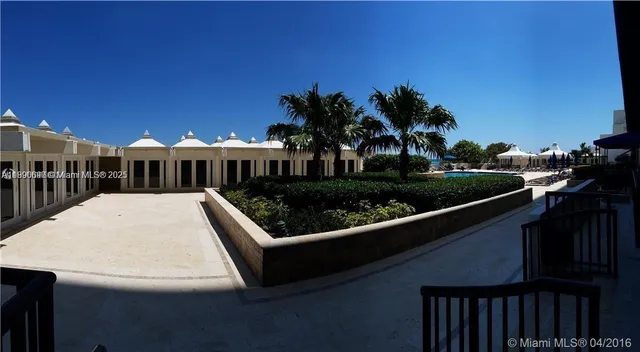 a view of a chair and tables the patio