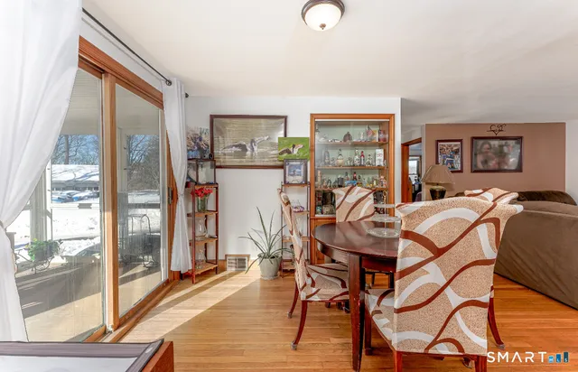 a view of a dining room with furniture window and outside view