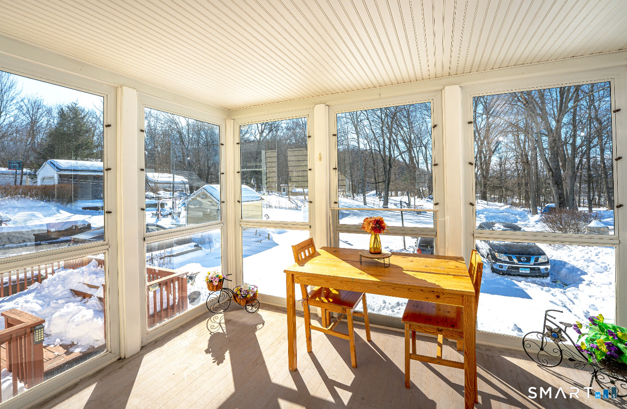 136 Pearl Lake Road Waterbury, CT 06706 - Photo 13 of 35 a view of a dining room with furniture water view and a large window