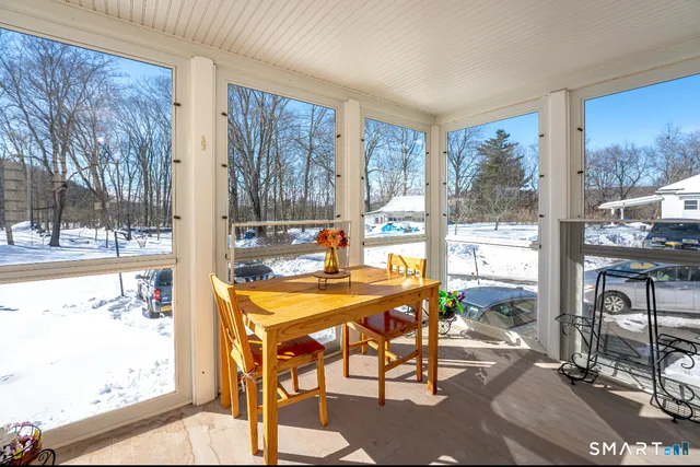 a view of a dining room with furniture window and outside view