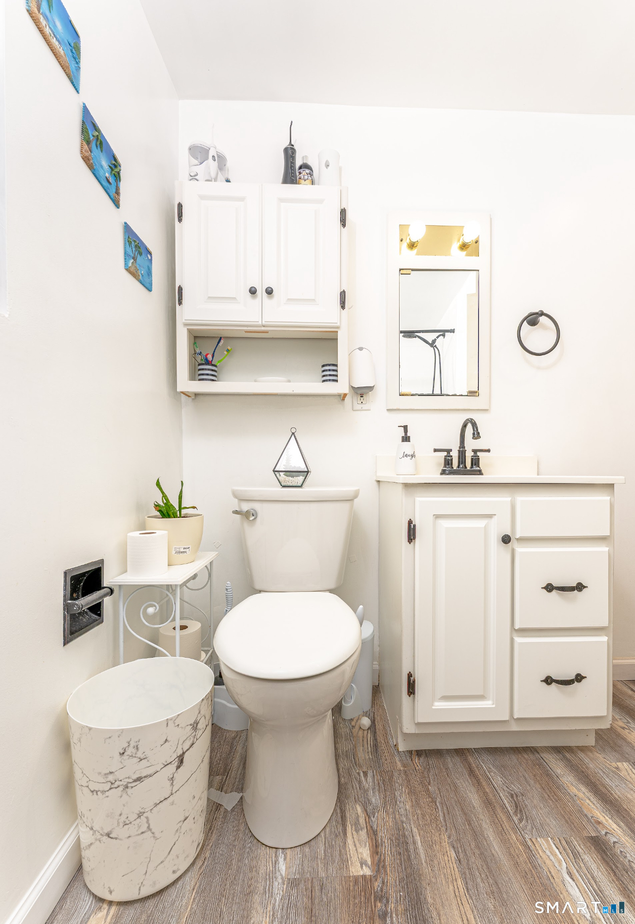 136 Pearl Lake Road Waterbury, CT 06706 - Photo 15 of 35 a bathroom with a sink toilet and mirror