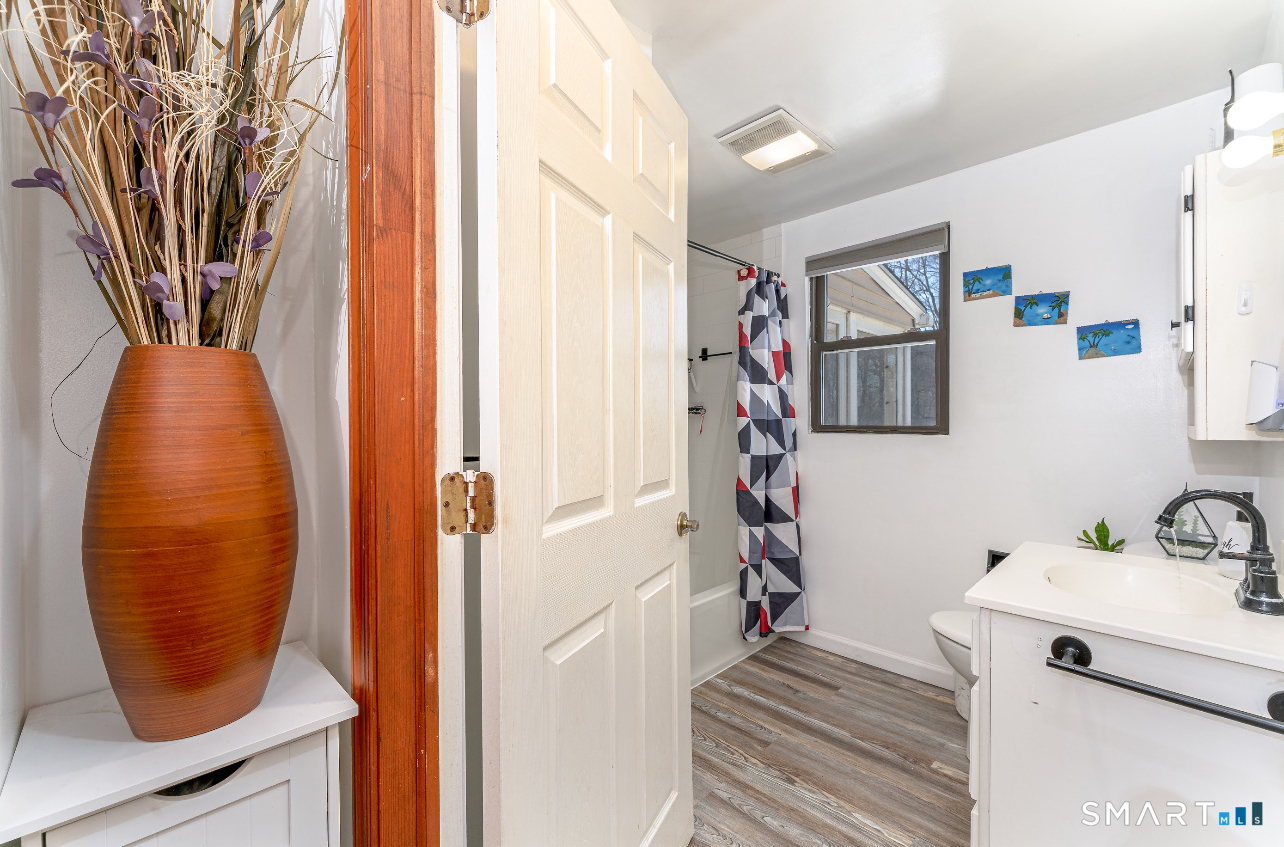 136 Pearl Lake Road Waterbury, CT 06706 - Photo 16 of 35 a view of a hallway with paintings on the wall