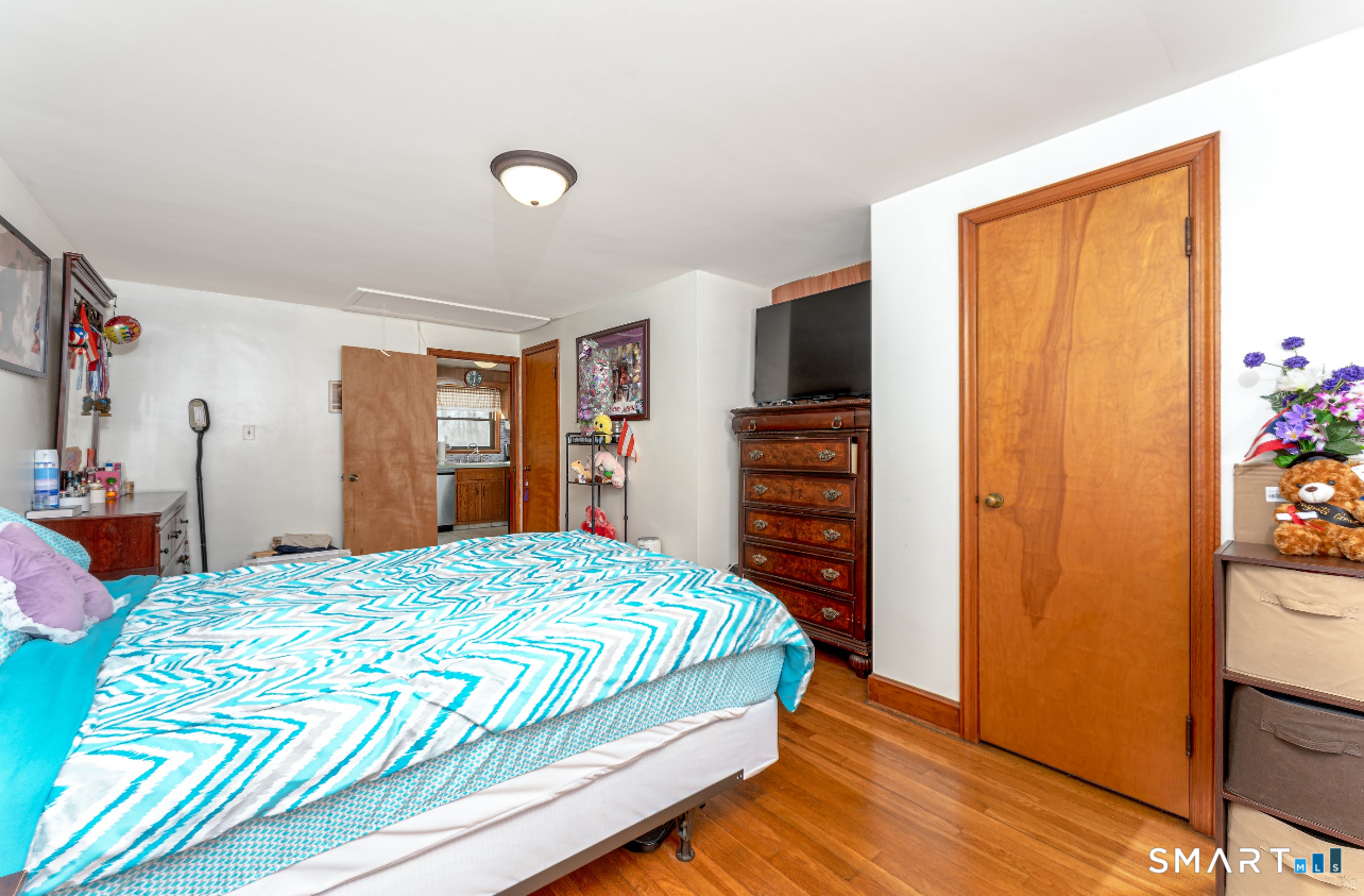 136 Pearl Lake Road Waterbury, CT 06706 - Photo 21 of 35 a bedroom with a bed and a dresser