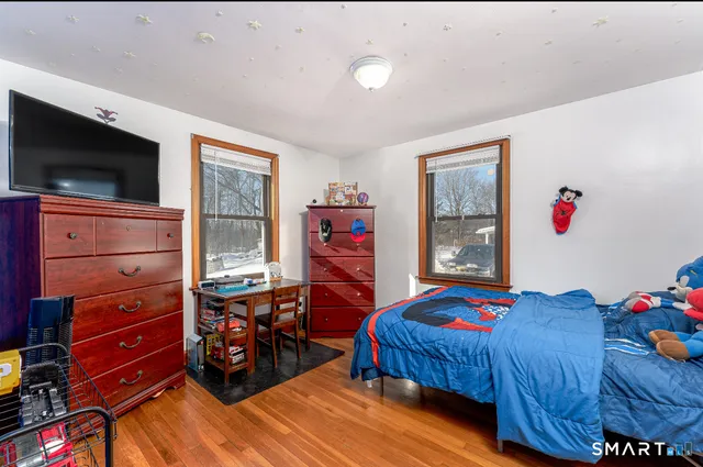 a bedroom with a bed and furniture