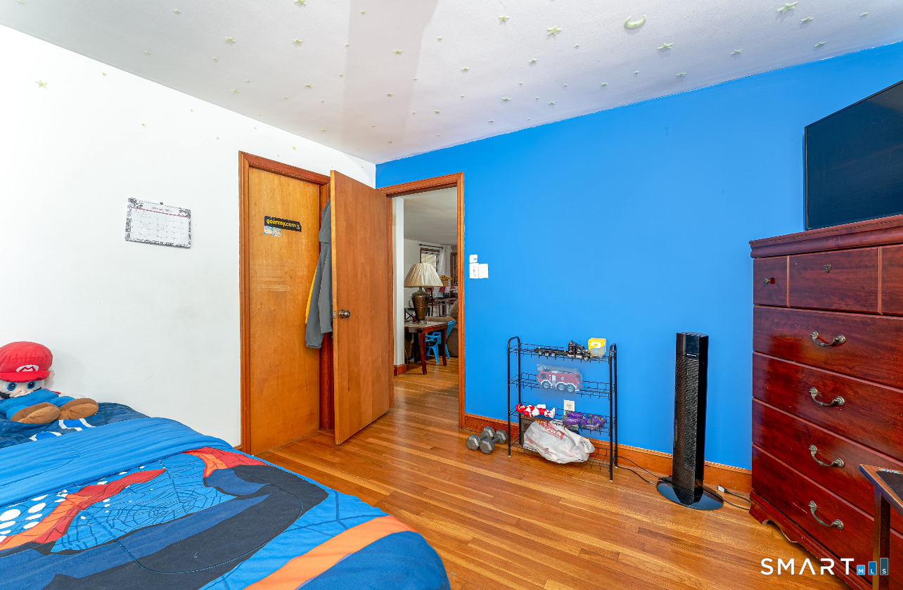 136 Pearl Lake Road Waterbury, CT 06706 - Photo 25 of 35 a view of a room with wooden floor and furniture