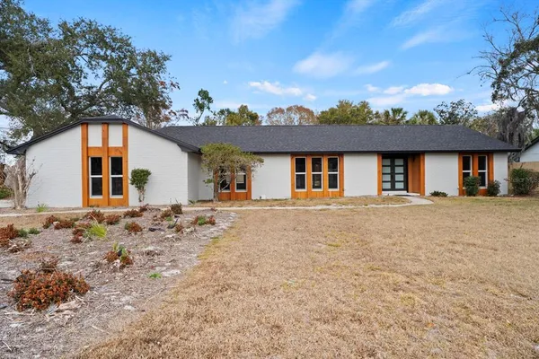 front view of a house with a yard