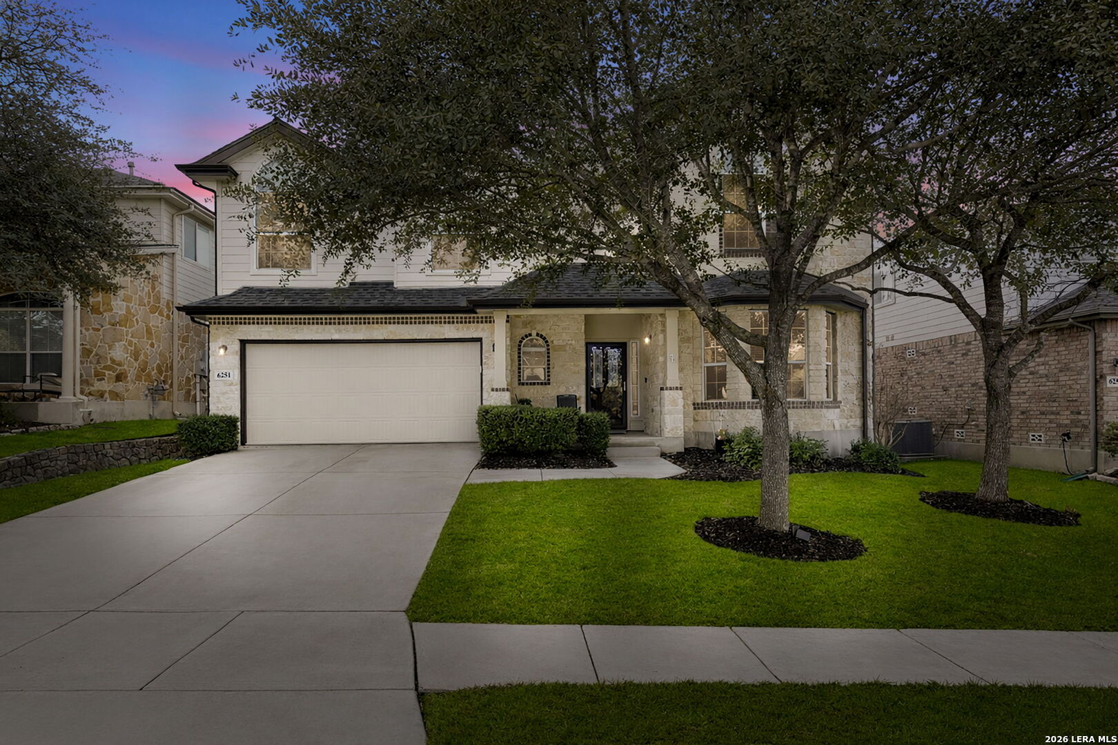 6251 Ozona Mill San Antonio, TX 78253 - Photo 1 of 1 front view of a house with a yard and trees