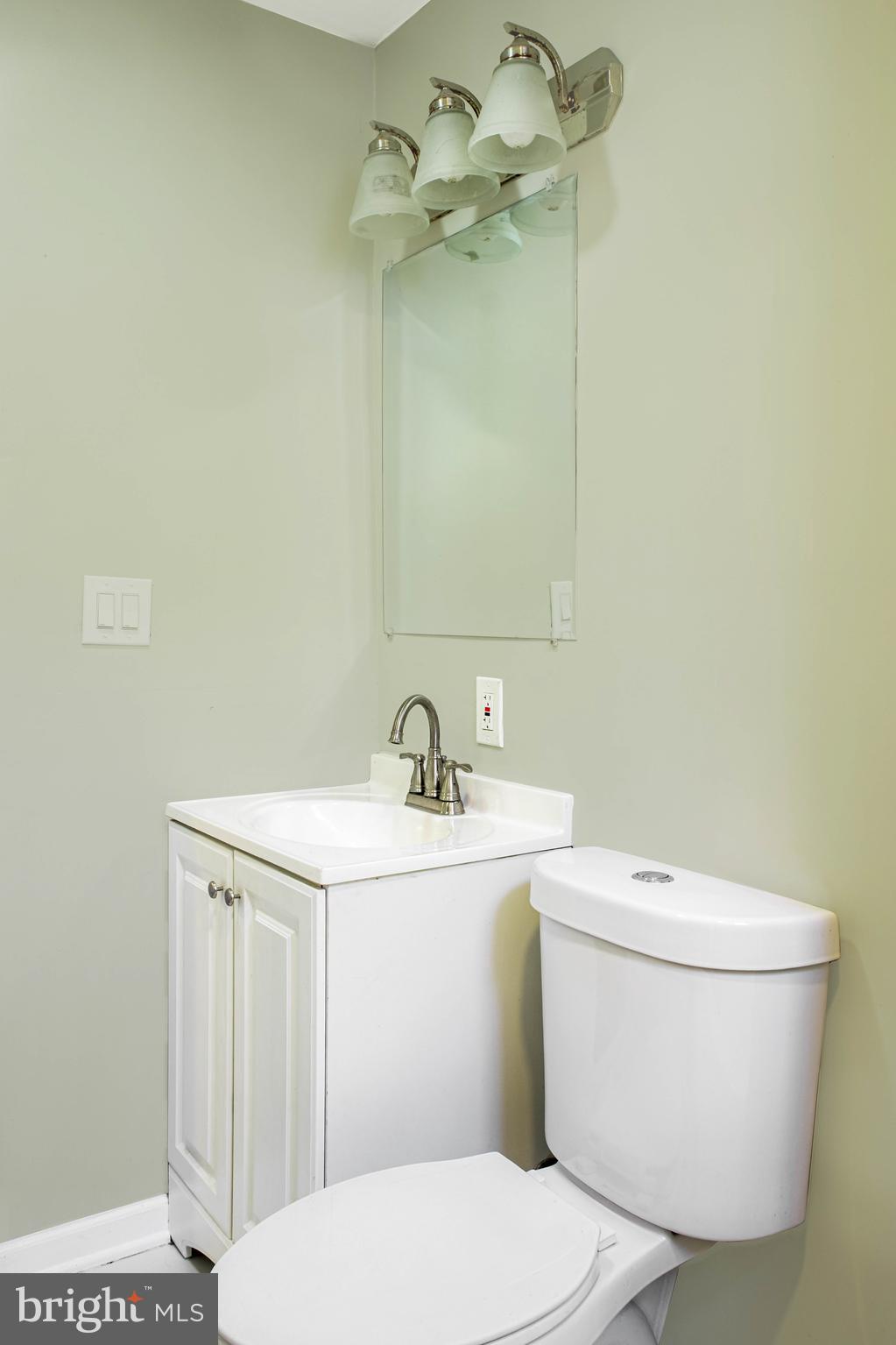 2137 Mifflin Street Philadelphia, PA 19145 - Photo 10 of 21 a white toilet sitting next to a bathroom sink