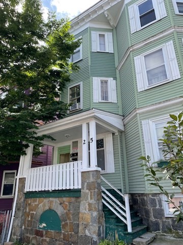 25 Wolcott Street Boston, MA 02121 - Photo 1 of 14 a front view of a house with a balcony