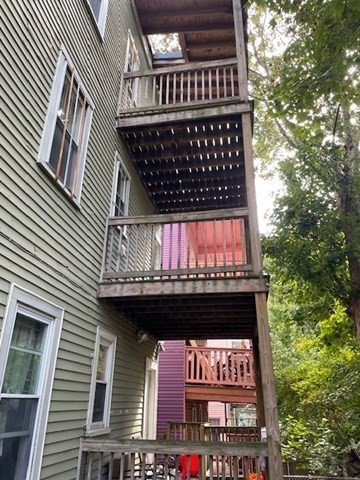 25 Wolcott Street Boston, MA 02121 - Photo 12 of 14 a sign on the side of a building