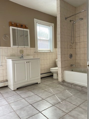 25 Wolcott Street Boston, MA 02121 - Photo 5 of 14 a bathroom with a sink a toilet and bathtub