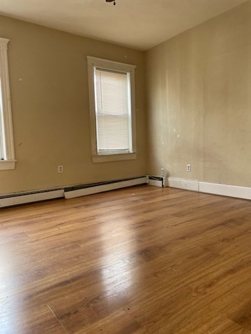 25 Wolcott Street Boston, MA 02121 - Photo 8 of 14 a view of a room with wooden floor and window
