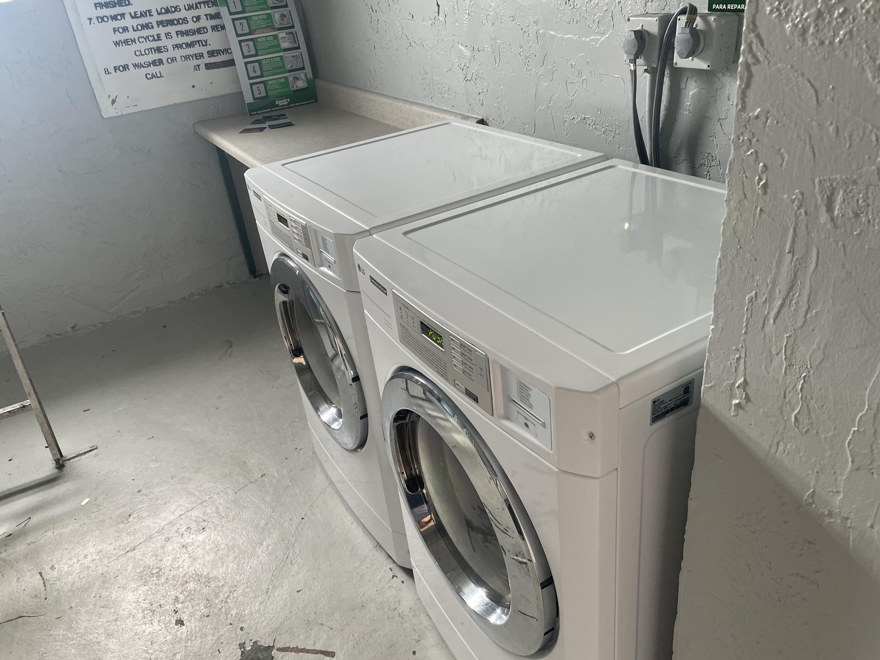 725 Lori Drive, Unit 406 Palm Springs, FL 33461 - Photo 20 of 40 a utility room with dryer and washer