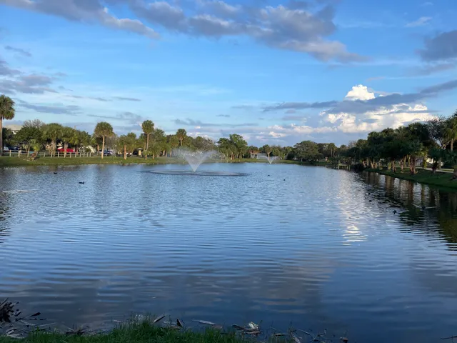 a view of a lake with houses in the back