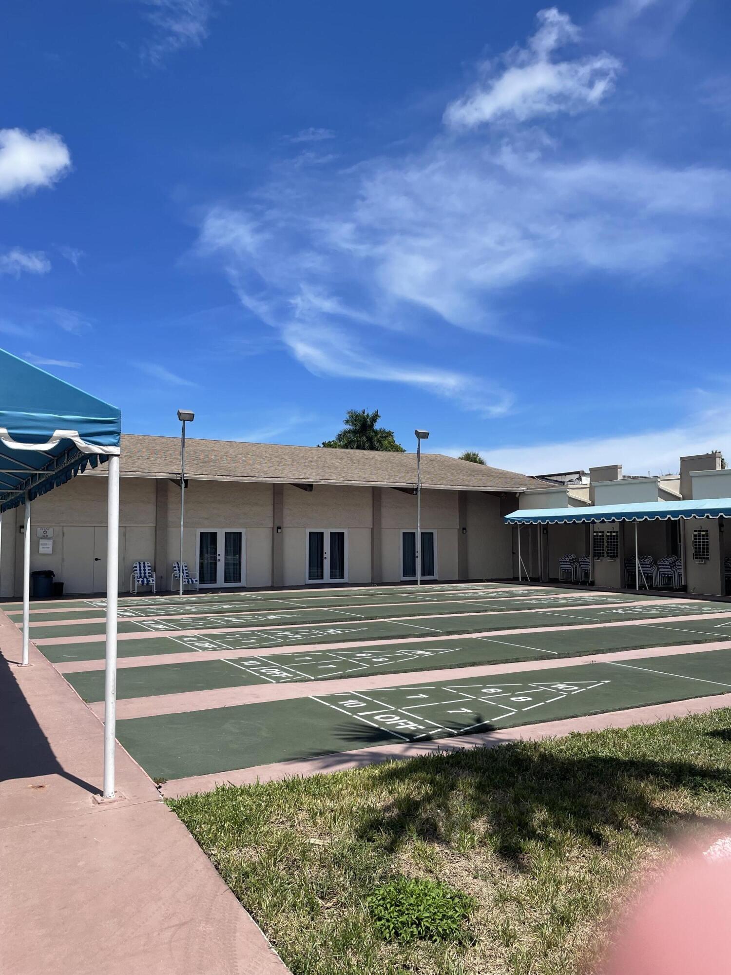 725 Lori Drive, Unit 406 Palm Springs, FL 33461 - Photo 33 of 40 a view of a house with a balcony