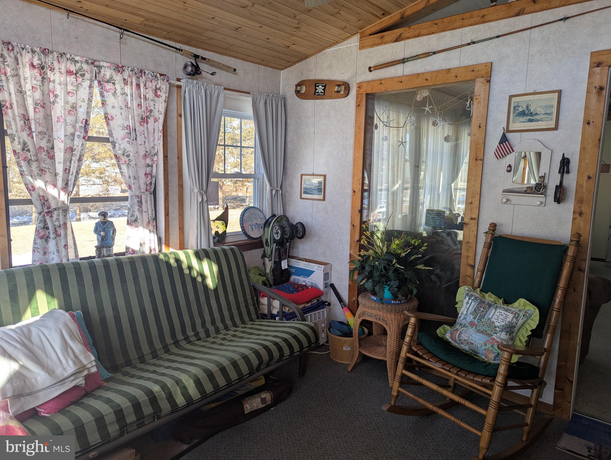 33501 Grape Street Millsboro, DE 19966 - Photo 4 of 38 a living room with furniture and a window