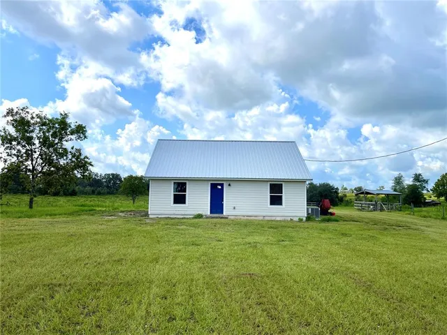 a house view with a garden space
