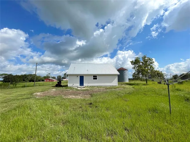 a view of a big yard with a house