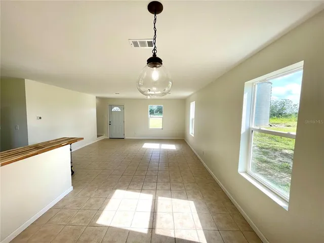 a view of an empty room and window