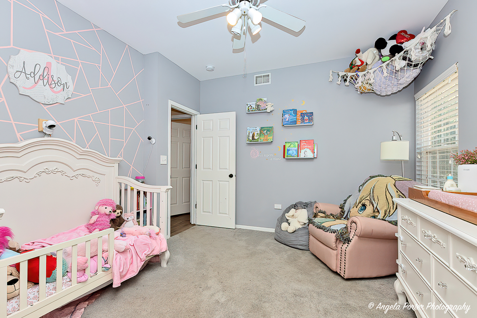 119 Eagle Point Road Fox Lake, IL 60020 - Photo 14 of 29 a bedroom with furniture and a chandelier
