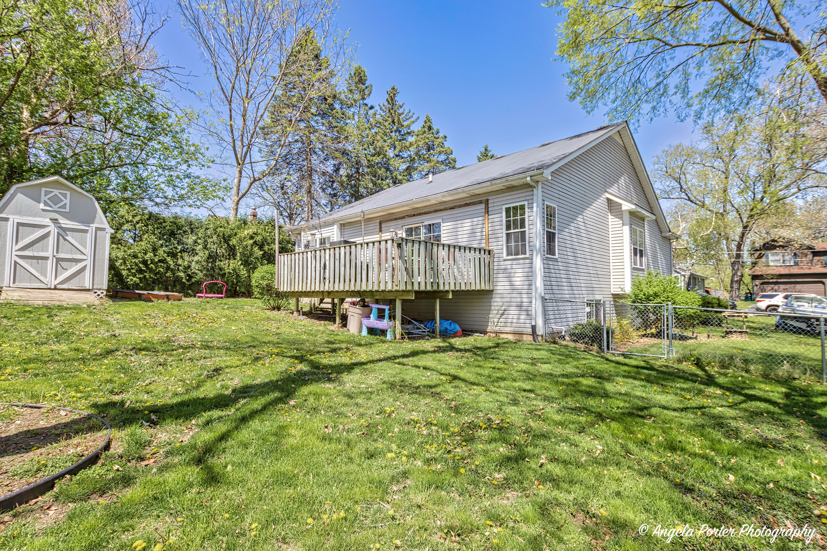 119 Eagle Point Road Fox Lake, IL 60020 - Photo 23 of 29 a view of a house with backyard and trees