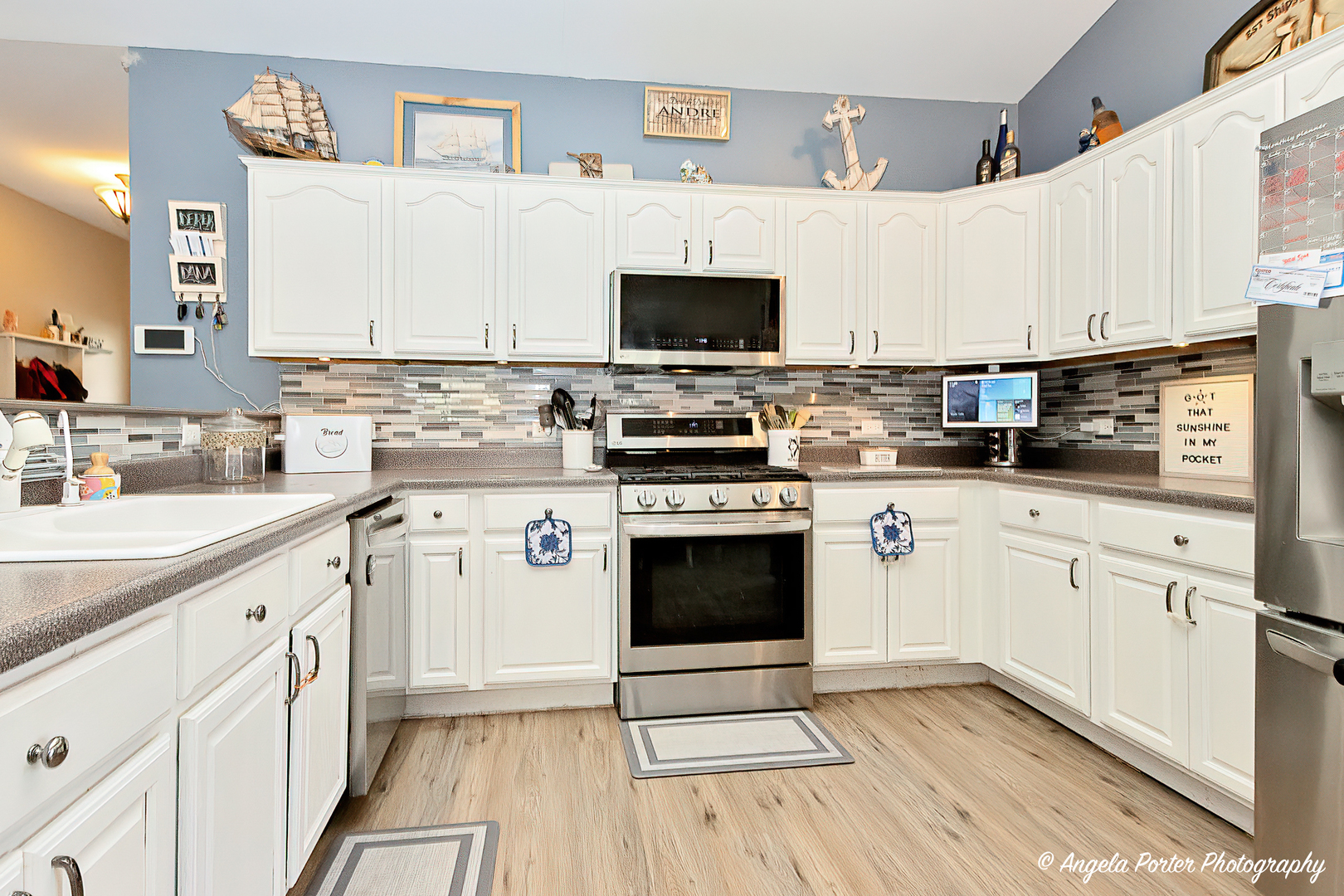 119 Eagle Point Road Fox Lake, IL 60020 - Photo 5 of 29 a kitchen with cabinets stainless steel appliances and a sink