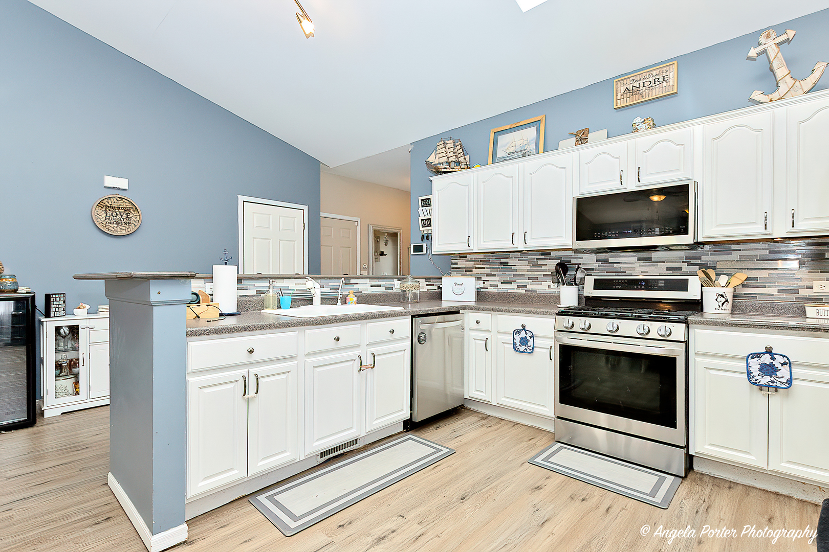 119 Eagle Point Road Fox Lake, IL 60020 - Photo 6 of 29 a kitchen with cabinets stainless steel appliances and a sink