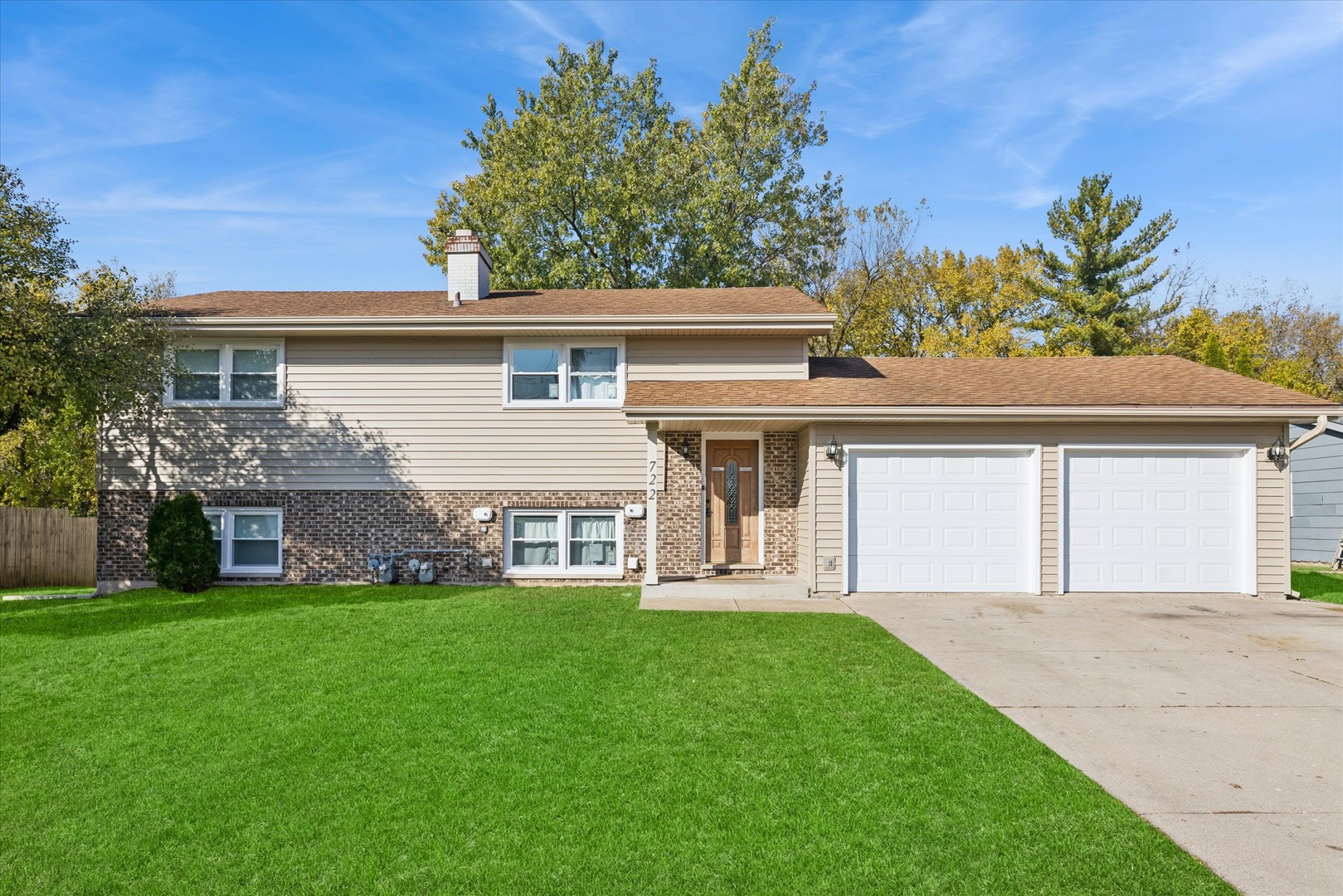 a front view of house with yard and outdoor seating