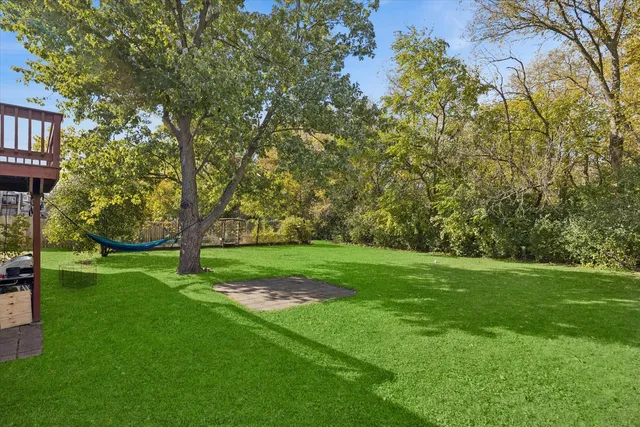 a view of field with trees in the background