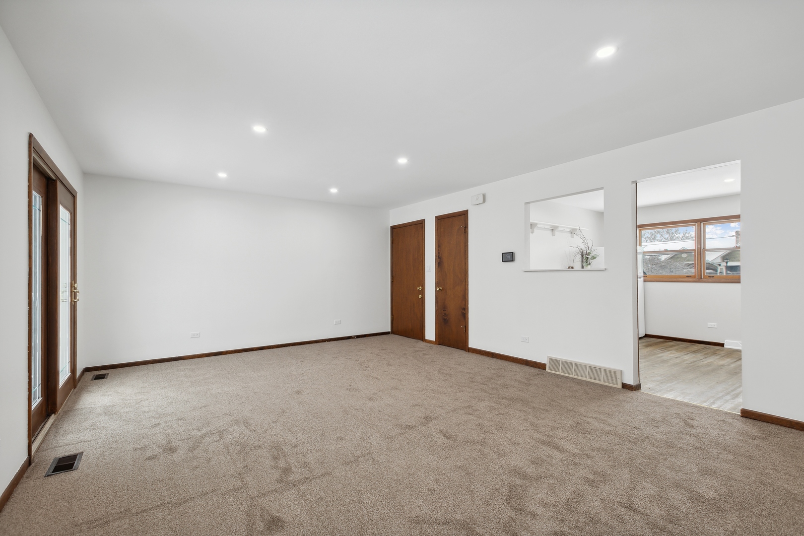 722 McHenry Avenue, Unit B Crystal Lake, IL 60014 - Photo 5 of 14 an empty room with closet and mirrors