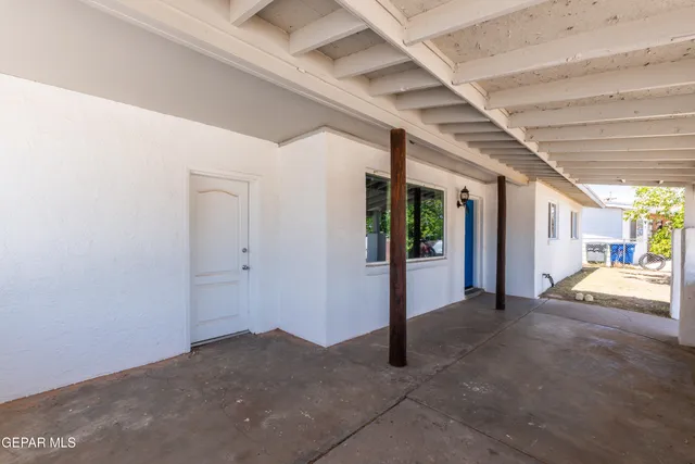 a view of a hall with wooden floor