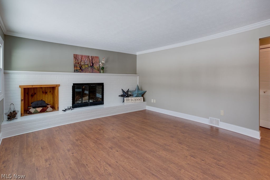 12529 Pearl Road Chardon, OH 44024 - Photo 6 of 33 ANother view of the area which is spacious for all your furniture, plenty of knickknacks for the settee in front of the fireplace and also on the mantle....also a full wall for your big screen for hours of relaxation.