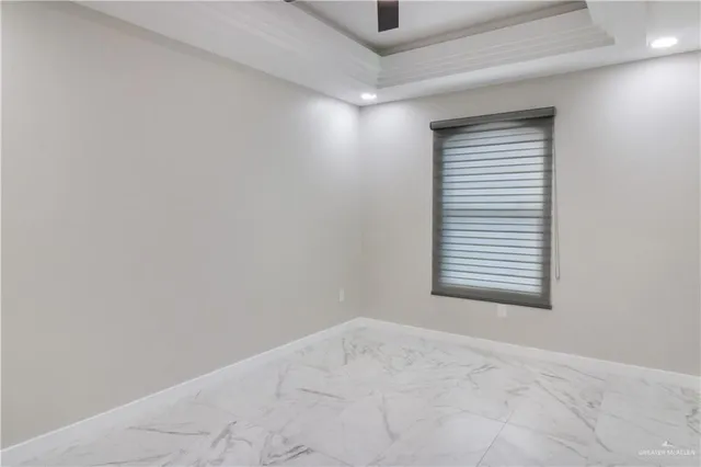 a bedroom with a bed and a lamp