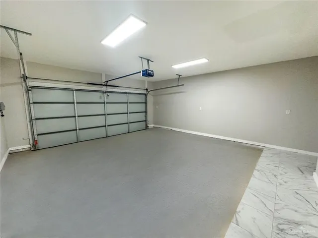 a bathroom with a granite countertop toilet and sink