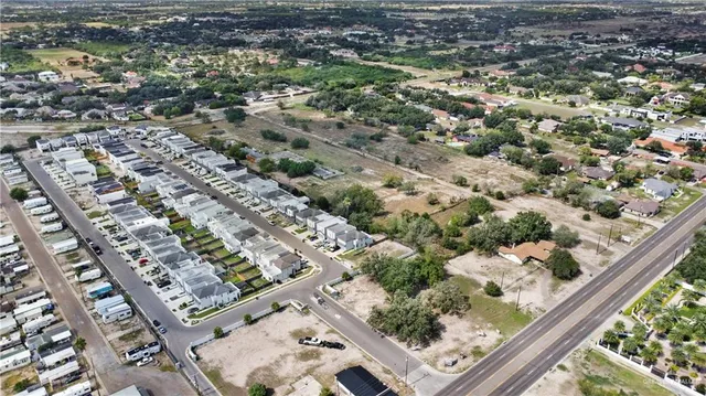 a view of a patio with dining table and chairs