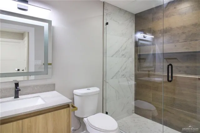 en empty room with windows and fan