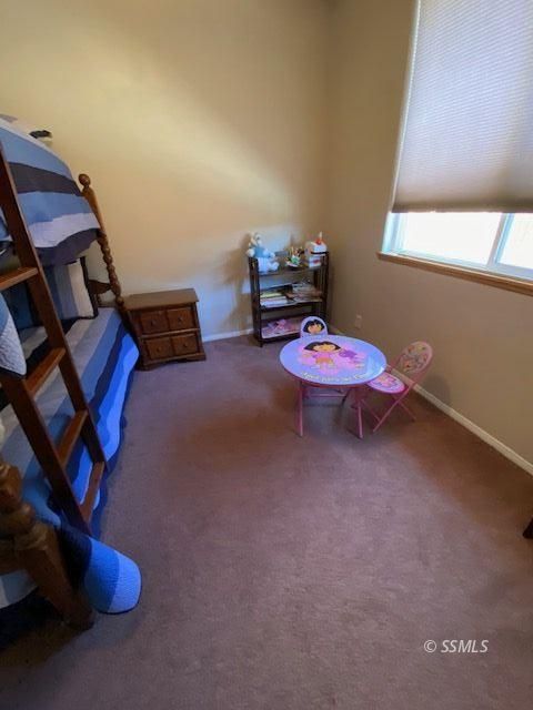 1145 West St George Avenue Ridgecrest, CA 93555 - Photo 10 of 16 a room with furniture and gym equipment