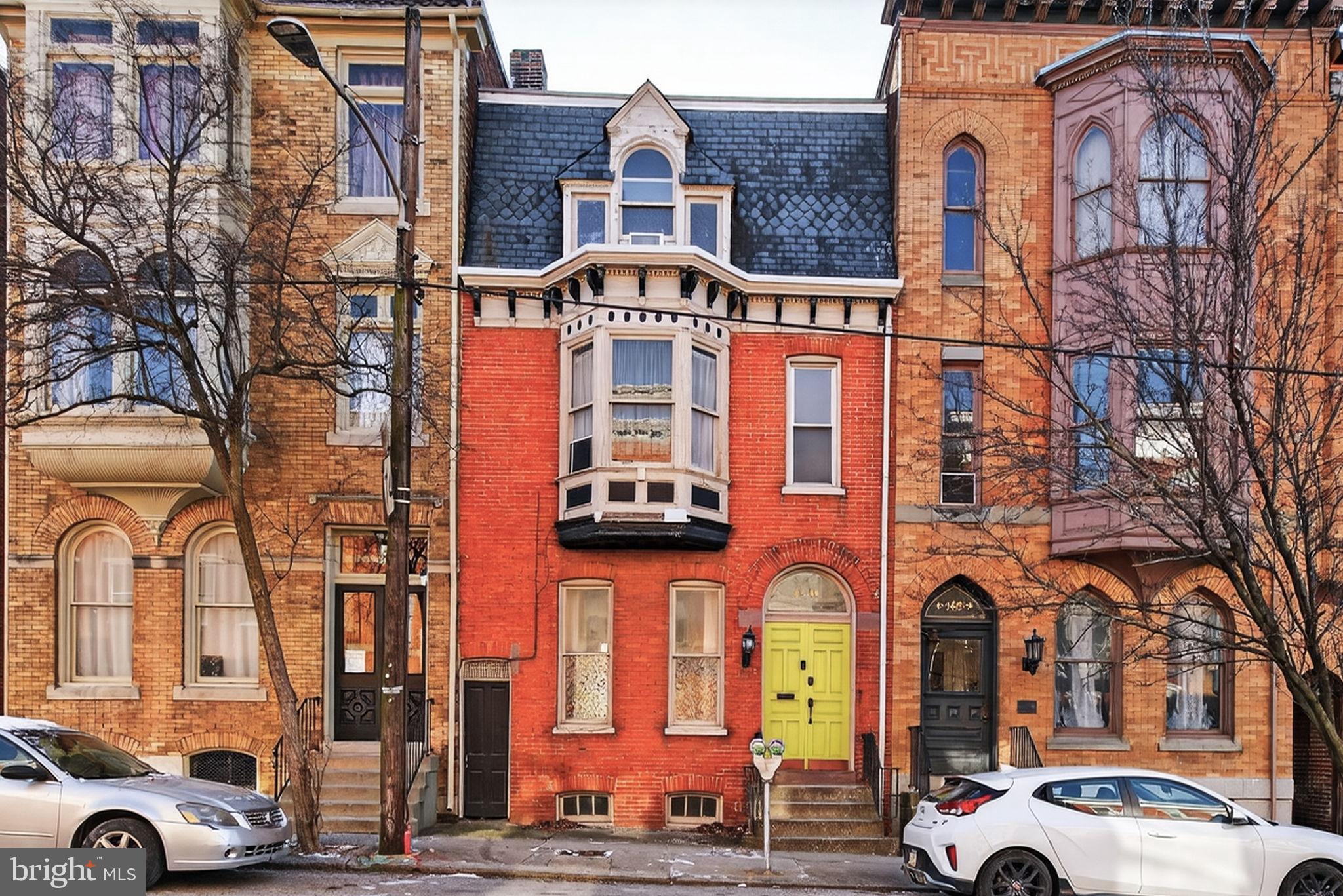 a front view of a building with parking space