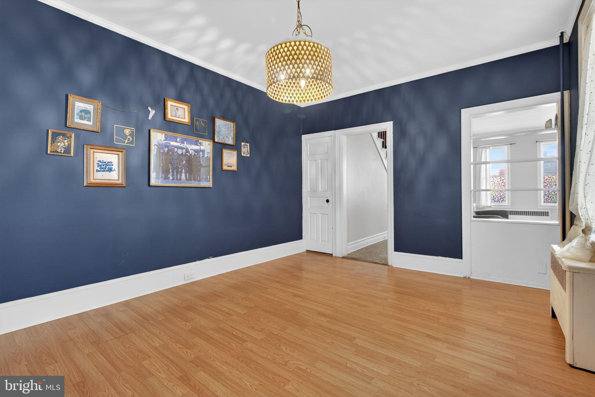 150 East Philadelphia Street York, PA 17401 - Photo 11 of 34 a view of a hallway with wooden floor and a chandelier